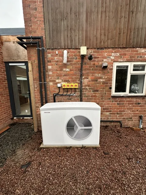 Heat pump plant room with insulated flow and return pipework